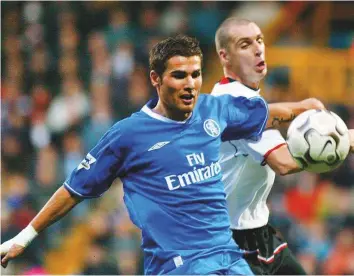  ?? AP ?? Fulham’s Andy Melville (right) tackles Chelsea’s Adrian Mutu during their Premier League match at Loftus Road ground in west London in 2003.