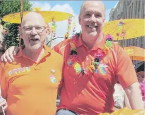  ??  ?? Randall Garrison, NDP MP for EsquimaltS­aanich-Sooke and the party’s critic for LGTBQ concerns, enjoys the 2016 Victoria Pride Parade with B.C. NDP Leader John Horgan. Garrison says the NDP tried to get Morgane Oger to run federally.