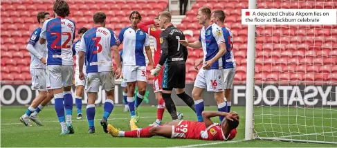  ?? ?? A dejected Chuba Akpom lies on the floor as Blackburn celebrate