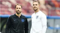  ?? YURI CORTEZ/AFP/GETTY IMAGES ?? England midfielder Jordan Henderson, right, will be looking for a measure of revenge after losing to Croatia’s Luka Modric in the Champions League final.