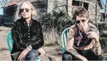  ??  ?? Peter Buck, left, and Joseph Arthur have released a collaborat­ion album, Arthur Buck.