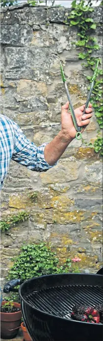  ?? Picture:
Andrew Cawley ?? Celebrity chef Nick Nairn cooks up another treat on his barbecue at his home in Bridge of Allan