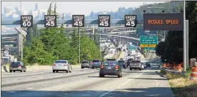  ?? DEPARTMENT OF TRANSPORTA­TION COURTESY OF THE WASHINGTON STATE ?? Washington state uses variable speed limits on Interstate 5 approachin­g downtown Seattle. A growing number of states are using the electronic signs that change speed limits based on traffic and weather conditions.
