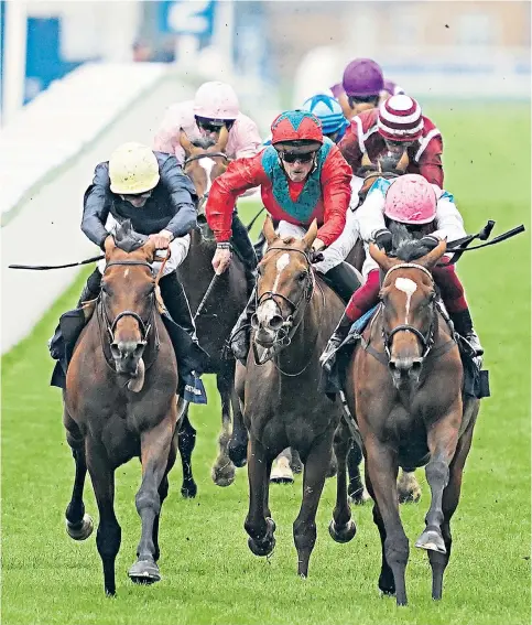  ??  ?? Neck and neck: Frankie Dettori keeps Enable (right) ahead of Crystal Ocean (left) to win the King George VI and Queen Elizabeth Qipco Stakes at Ascot