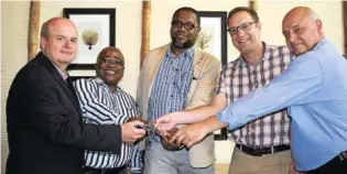  ??  ?? NEW HANDS: The keys to the Fish River Sun were handed over to the department of rural developmen­t and land reform (DRDLR) on Friday, and they in turn handed them over to The Mantis Collection. From left are general manager of the Sun Boardwalk Mike van Vuuren, DRDLR acting chief director of the commission for the Eastern Cape Zama Memela, DRDLR director of legal at the national office Isaac Peter, Mantis Collection director Carl Haller and DRDLR provincial security coordinato­r Christiaan Coetzee