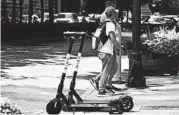  ?? JOHN BAZEMORE/AP ?? Atlanta is banning electric scooters during nighttime hours during what has been a deadly summer for riders.