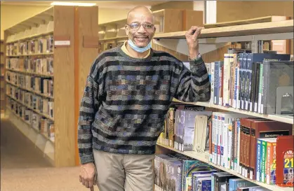  ?? MICHAEL GARD/POST-TRIBUNE ?? Ken Stalling said he experience­d a happy change in life during 2020 as he was promoted to manager of the library’s John F. Kennedy branch.