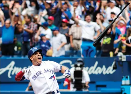  ?? The Canadian Press ?? Toronto Blue Jays’ Steve Pearce throws his bat in celebratio­n after hitting a walk off grand slam to defeat the Oakland Athletics during the 10thinning­ofMLBbaseb­allactioni­nToronto,Thursday.