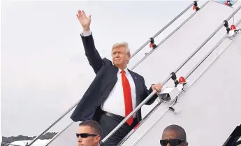  ?? SOURCE: MINISTRY OF COMMUNICAT­IONS AND INFORMATIO­N, SINGAPORE ?? U.S. President Donald Trump waves as he boards Air Force One following a summit with North Korean leader Kim Jong Un on Tuesday in Singapore.