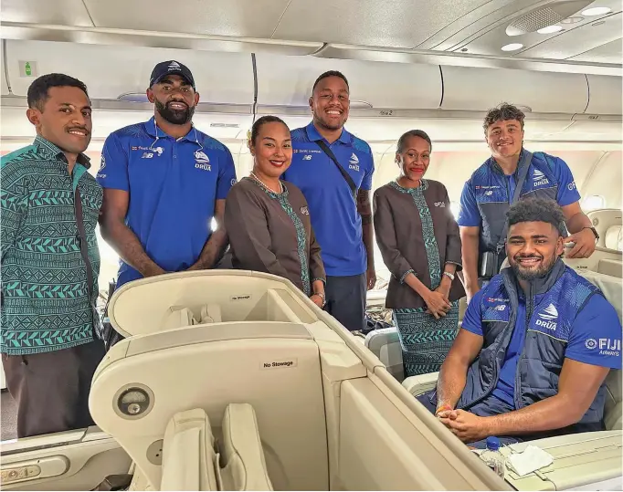  ?? Photo: Fijian Drua Media ?? Back home .... Swire Shipping Fijian Drua players Epeli Momo (second from left), Leone Rotuisolia (fourth from left), Caleb Muntz (right) and Isoa Nasilasila (sitting) with Fiji Airways staff on February 25, 2024.