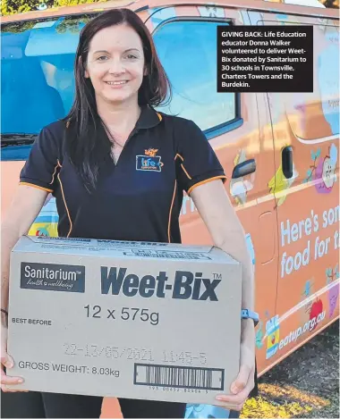  ??  ?? GIVING BACK: Life Education educator Donna Walker volunteere­d to deliver WeetBix donated by Sanitarium to 30 schools in Townsville, Charters Towers and the Burdekin.