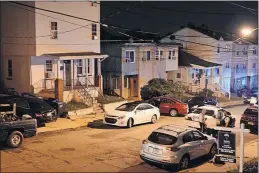  ?? [PHOTO COURTESTY OF THE U.S. ATTORNEY’S OFFICE] ?? Officers gather on the street where they captured Romeo Hayes after a 4-mile chase followed by Hayes bailing out of the car and sprinting through back yards.