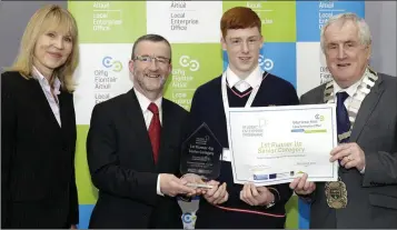  ??  ?? FIRST RUNNER-UP: James Byrne of ‘Wicklow Bed and Mattress Removal’ from Coláiste Chill Mhantáin receives his prize from Sheelagh Daly, Bryan Doyle and Cllr Pat Fitzgerald.