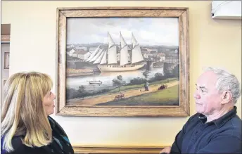  ?? FRAM DINSHAW/THE NEWS ?? New Glasgow Mayor Nancy Dicks and Deputy Mayor Clyde Fraser took time to admire and discuss the newly unveiled portrait of the iron-hull schooner James William — a vessel built in New Glasgow in 1908, and lost five years later, when it ran aground....