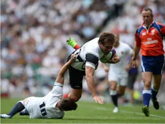  ?? (Getty) ?? Francois Steyn is brought down by George Ford