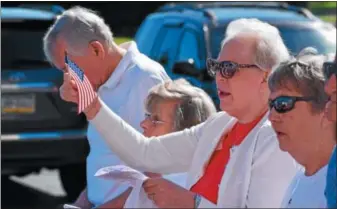  ?? MARIAN DENNIS – DIGITAL FIRST MEDIA ?? Residents at Keystone Villa waved their American flags and sang along to “America the Beautiful” Thursday morning during a Flag Day ceremony.