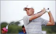  ?? VERNON BRYANT — THE DALLAS MORNING NEWS VIA AP ?? Jordan Spieth watches his ball after hitting from the fairway on the first hole during the pro-am at the AT&T Byron Nelson golf tournament at Trinity Forest Golf Club in Dallas, Wednesday.