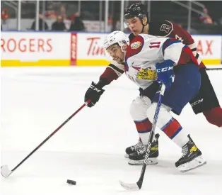  ?? IAN KUCERAK ?? Oil Kings forward Dylan Guenther battles the Red Deer Rebels' Christoffe­r Sedoff during Game 1 of their second-round WHL playoff series Thursday at Rogers Place. The Oil Kings won 4-0.