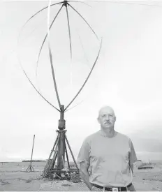  ?? GREG PENDER ?? Glen Lux stands in front of a home-built early prototype of his wind turbine in 2010. Crowdfundi­ng to build a new prototype failed.