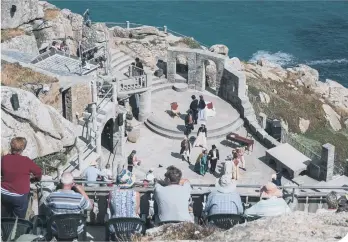  ??  ?? People watching a show at the Minack Theatre near Penzance. (Photo: Matt Cardy/Getty Images)
