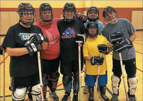  ?? SUBMITTED PHOTO ?? At a recent floor hockey practice at the Ambler YMCA are Special Olympics athletes (from left) Melissa Woerner, Annemarie Davis, Kim Eckart, Patrick Wise, Bobby Johnson (in yellow) and Robert Cook.