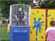  ??  ?? Souderton Police Off. Jeff Lukens sits in the dunk tank at Souderton Community Night Out Aug. 15 in Souderton Community Park.