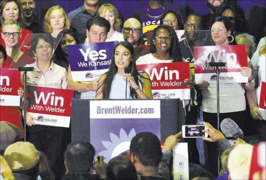  ?? Luke Harbur The Associated Press ?? New York congressio­nal candidate Alexandra Ocasio-Cortez speaks Friday in support of Kansas Democrat Brent Welder at the Jack Reardon Convention Center in Kanas City, Kan.