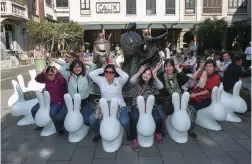  ??  ?? Visitors interact with “Rabbit in the City” designed by Stefano Giovannoni. — Photos by Wang Rongjiang