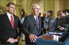  ?? J. SCOTT APPLEWHITE / AP ?? Senate Majority Leader Mitch McConnell (center), R-Ky., struck a nerve by telling an audience in his home state that President Donald Trump had “not been in this line of work before” and had “excessive expectatio­ns” about the process.