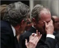  ??  ?? Former President George W. Bush, right, cries after speaking during the State Funeral for his father, former President George H.W. Bush, at the National Cathedral, Wednesday