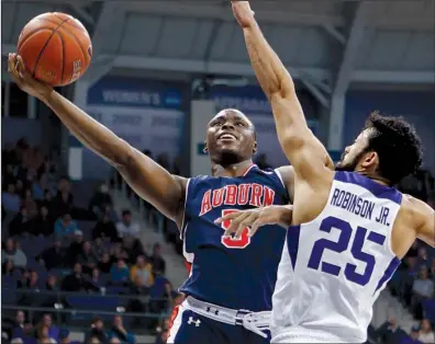  ?? AP/PAUL MOSELEY ?? Auburn guard Mustapha Heron (left) is averaging a team-leading 15.0 points and 5.8 rebounds per game as one of four freshman starters for the Tigers, who have lost three of their past four games going into today’s matchup against the Arkansas Razorbacks.