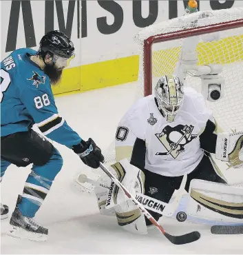  ?? ERIC RISBERG/THE CANADIAN PRESS ?? Matt Murray in one of his 18 playoff starts this season, stopping Brent Burns.