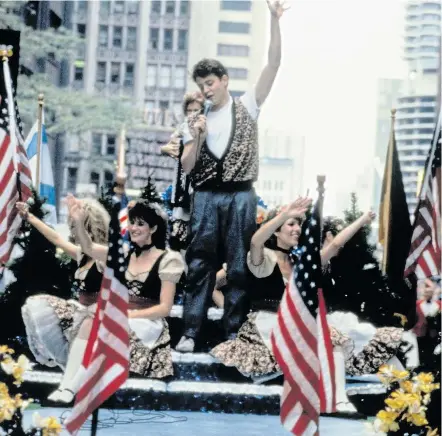  ??  ?? THAT’S ENTERTAINM­ENT: Matthew Broderick plays to the crowds in a scene from the film Ferris Bueller’s Day Off