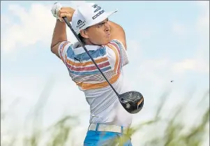  ?? JOHN EHLKE/WEST BEND DAILY NEWS VIA AP ?? Rickie Fowler watches his tee shot on No. 5 during the first round of the U.S. Open golf tournament, Thursday, at Erin Hills in Erin, Wis.