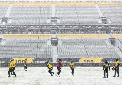 ?? NICK IWANYSHYN THE CANADIAN PRESS ?? Hamilton Tiger-Cats teammates, top, take part in a practice session at Tim Hortons Field this week.