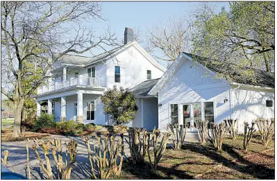  ?? NWA Democrat-Gazette/DAVID GOTTSCHALK ?? The Blake House at 301 NE Blake St. collapsed last week as it was being moved to construct a new foundation. The house was going to be part of a social and wellness club by a company supported by the Walton family.