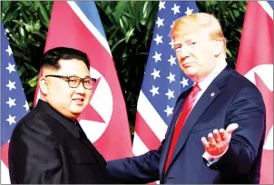  ?? SAUL LOEB/AFP ?? US President Donald Trump (right) meets North Korean leader Kim Jong-un at the start of their US-North Korea summit in Singapore on June 12.