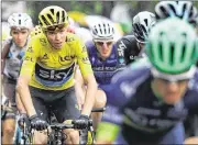  ?? MICHAEL STEELE / GETTY IMAGES ?? Surrounded by Team Sky teammates, Chris Froome keeps his lead intact — practicall­y assuring his third Tour de France title in four years.