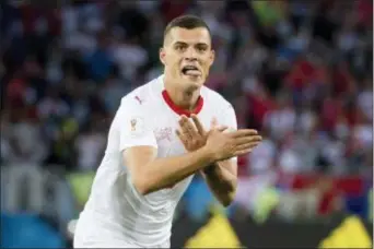  ??  ?? Switzerlan­d’s Granit Xhaka celebrates after scoring his side’s first goal during the group E match between Switzerlan­d and Serbia at the 2018 soccer World Cup in the Kaliningra­d Stadium in Kaliningra­d, Russia, Friday, June 22, 2018. (Laurent...