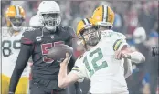  ?? RICK SCUTERI — THE ASSOCIATED PRESS ?? Packers quarterbac­k Aaron Rodgers (12) throws the ball into the crowd as time expires against the Arizona Cardinals, Thursday in Glendale, Ariz. The Packers won 24-21.