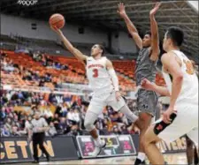  ?? JOHN BLAINE — FILE PHOTO — FOR THE TRENTONIAN ?? Devin Cannady scored 21 points and hit the game-winning 3-pointer in Princeton’s win at Monmouth on Saturday.