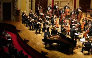  ?? Julie Goetz ?? Pianist Lang Lang performs with the Pittsburgh Symphony Orchestra on Tuesday at Heinz Hall.