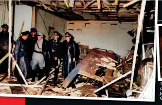  ?? ?? Reichsmars­chall Herman Göring talking to Reichsmini­ster Martin Bormann as he shows him and some Luftwaffe officers, the destroyed interior of Hitler’s briefing room. Note the condition of the conference table