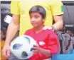  ??  ?? A screengrab of Nathania K. John carrying the official match ball for the Brazil- Costa Rica clash.