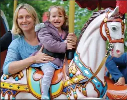  ??  ?? ALL ABOARD: Joanna and Belle on the park’s Victorian-style carousel