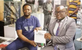  ?? - Picture: Charles Muchakagar­a ?? Informatio­n, Publicity and Broadcasti­ng Services Minister Dr Jenfan Muswere (right) receives the Africa Fact Book from chief executive Ambassador Kwame Muzawazi during the tour of the Museum of African Liberation in Harare yesterday.