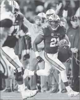  ?? CURTIS COMPTON — ATLANTA JOURNAL-CONSTITUTI­ON VIA AP ?? Auburn running back Kerryon Johnson, right, ran for 167 yards Saturday.