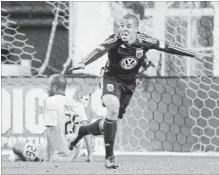  ?? ASSOCIATED PRESS FILE PHOTO ?? D.C. United's Charlie Davies, right, reacts after scoring a goal against the Columbus Crew's Julius James (26) during the second half of a Major League Soccer game in Washington in March 2011.