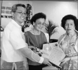  ??  ?? Dr. Helena Benitez (right), PHEA founding president with Dr. Leticia Navarro (PHEA March lyricist) and Albert Rosarda (PHEA March co-lyricist) during the launching of the Philippine Home Economics Associatio­n March.