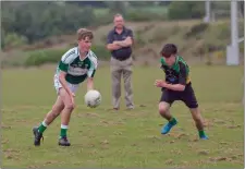  ??  ?? Action from Avondale v Clann na Gael in Ballinakil­l.